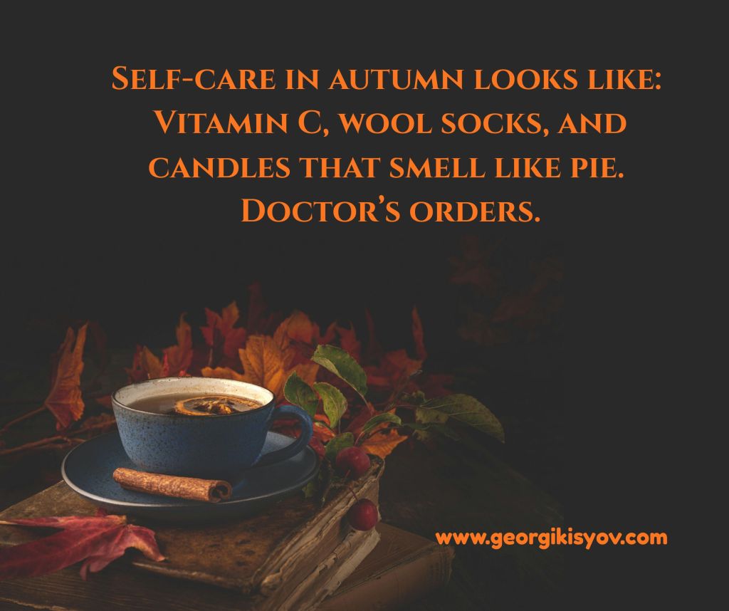 Cup of tea, autumn leaves, and a cozy quote about self-care in fall with socks, vitamins, and candles.